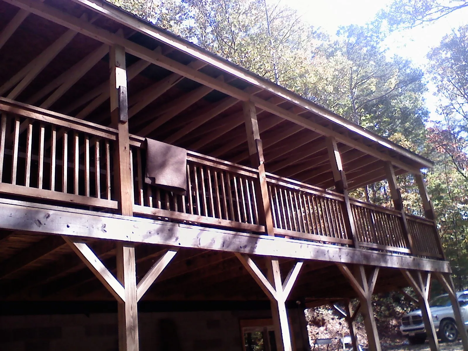 Timber framing under a new elevated porch and deck — Roof Leak Repair in Dearborn by Roofing Brothers